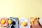 Blue jeans, white shirt, sunglasses, string bag and crochet hat and lemons on yellow background. Women`s stylish spring summer