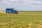 Blue Jeep Wrangler Rubicon Unlimited in steppe near Utta village.