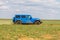 Blue Jeep Wrangler Rubicon Unlimited in steppe near Utta village.