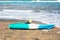 Blue kayak lying on the sandy beach
