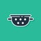 Blue Kitchen colander icon isolated on green background. Cooking utensil. Cutlery sign. Vector