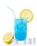 Blue lagoon drink with lemon,straw and ice cubes on white