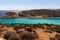 He Blue Lagoon is a popular  small bay for a day trip with shallow, azure-coloured water on the West coast of Comino island