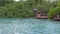 Blue Lagoon Vanuatu, tourists jumping of ropes into the water.