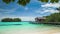 Blue lagune with calm clear water in front of bamboo huts on wooden stocks of an homestay, Gam Island, West Papuan, Raja