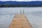 blue lake with beautiful Mauritius palm trees reflecting in the calm waters of the lake, with wooden pier in Amazon