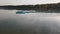 Blue lake, blue sky and blue plastic pier. Small dock for boat and ship at the lake. Long pier on blue lake.