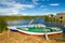 Blue lake with boats at the shore, titicaca lake