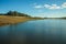 Blue lake on landscape of rural lowlands