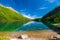 Blue Lake Morskie Oko and the green mountains of Tara