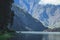 Blue Lake Segara Anak with green cliffs background