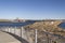 Blue Lane pedestrian path in New Bedford  overlooking hurricane barrier and survey vessels in port