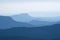 Blue layers of mountain ridges in the french alps