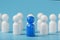 Blue leader the leader leads a group of employees in white to achieve the goal, personnel, and recruitment. The concept of
