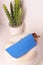 blue leather eyeglass case closeup photo on white wall background