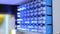 Blue lighting status indicator signals on electric control panel - close up