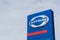 Blue logo of famous Japanese automotive company Datsun, on blue