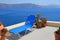 Blue lounge chair against the sea, Santorini