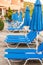 Blue lounge chairs and umbrellas by the pool