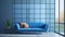 blue loveseat sofa against of large grid window. minimal design