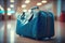 Blue luggage on airport floor departure and journey ahead.