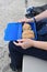 Blue lunchbox with bread held on lap