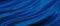 Blue luxury fabric background with copy space