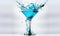 a blue martini with a splash of water on the rim