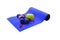 Blue mat with dumbbells green apple drink measuring tape