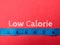 Blue measuring tape with the word Low Calorie