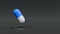 Blue and while medicine capsule hovering over flat surface with copy space. Pharmacy, pharma industry concept.