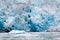 Blue Melting iceberg flowing into Alaskan sea