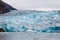 Blue Melting iceberg flowing in Arctic sea