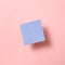 Blue memo pad, sticky note on pink background