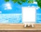 Blue Menu board with easel on wood table at sea with tree and s