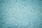 Blue messy wall stucco texture background. Decorative wall paint.