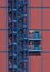 Blue metall staircase on red industrial building