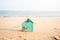 Blue miniature model house on the beach and blue sky background, house construction ideas