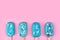 Blue mint ice cream popsicles on pastel pink background. Tasty and refreshing icecream on sticks. Minimal summer concept. Flat lay