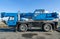 Blue mobile crane truck for heavy load - blue sky