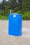 Blue modern plastic portable toilet in sandy beach