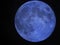 Blue Moon visible in night sky