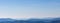 Blue mountains peaks panorama. Vastness and calmness concept. Clear blue sky over blue mountains on sunset.