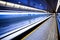 Blue moving escalator with people