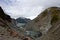 Blue Muddy Glacier Melting on Mountainside