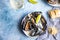 Blue mussels in a creamy white wine sauce served with lime and bread. Stew mussels in wine, leek and blue cheese. Seafood.