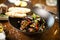 Blue mussels in white wine sauce in black bowl. Delicious healthy seafood closeup served on a table for lunch in modern