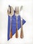 Blue napkin with set of tableware - spoon, fork and knife