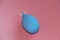 Blue nasal aspirator with glass tip. Suction of discharge from the baby spout