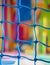 Blue net closeup in children playground. Colorful plastic background